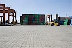 Limassol, Cyprus, Mobile crane moving containers in stockyard