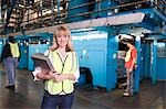 Woman working in newspaper factory, portrait