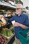 Senior man vegetable shopping