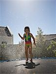 South Africa, Cape Town, girl jumping on trampoline