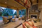 Open plan Palm Springs sitting room with lit fire