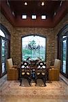 Dining table with sofas at window in Palm Springs home