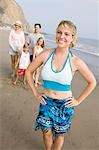 Portrait of woman on beach with family