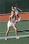 Tennis Player, returning serve in doubles game