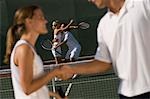 Tennis Players Shaking Hands at Net, side view