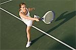 Tennis Player swinging racket in Forehand motion