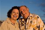 Senior couple smiling, outdoors, (portrait)