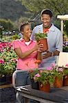 Couple choosing plants at nursery