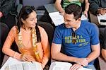 Student couple sitting in lecture hall