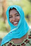 Portrait of muslim woman in blue headscarf, smiling