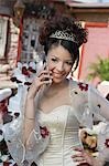 Girl (13-15) using mobile phone at Quinceanera, portrait