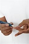 Man taking syringe from protective case, close-up of hands