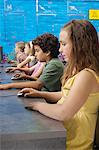 School children using computers in classroom