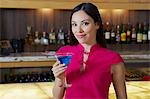 Woman Drinking a Blue Martini