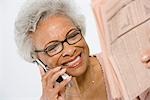 Cheerful Senior Woman Studying Stocks and Shares