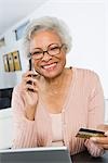 Cheerful Senior Woman Using Laptop, Holding Credit Card