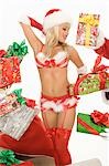 Mrs Claus in underwear surrounded by gifts