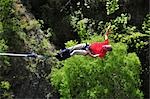 Man Bungee Jumping off Kawarau Suspension Bridge near Queenstown, South Island, New Zealand