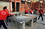 Shaolin students playing table tennis at Shaolin Monastery,Wushu Institute,Henan Province,China