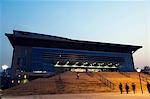 China,Beijing,Haidian district. The Table Tennis Stadium for the 2008 Beijing Olympics illuminated in the grounds of Beijing University.