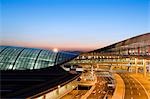 China,Beijing,Beijing Capital Airport. Illuminated at night,part of new Terminal 3 building opened February 2008,second largest building in the world.