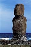 At Ahu Tahai,a single weathered moai sits on top of one of the three ahus or platforms of the ceremonial centre of Tahai. Tahai is just a short walk from Easter Island's main settlement,Hanga Roa on the west coast of the island,backed by the Pacific Ocean.