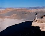 A tourist looks out over the Atacama Desert from Las Cornicas ridge.