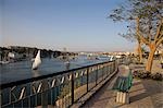 Feluccas sail along the Nile at Aswan,seen from the Ferial Gardens,Egypt