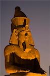 A larger than life statue of Ramses II illuminated at night in Luxor Temple,Egypt