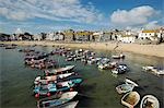 Boats in the harbour of St Ives,Cornwall. Once the home of one of the largest fishing fleets in Britain,the industry has since gone into decline. Tourism is now the primary industry of this popular seaside resort town.