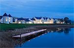 Northern Ireland,Fermanagh,Enniskillen. Lough Erne Golf Resort at night with the pontoon lit by lanterns.