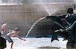 England,London. Fountain in the middle of Trafalgar Square. Added in 1845 (and substantially remodelled in 1939 by Lutyens) the two granite fountains in the Square feature mermen,mermaids and dolphins in bronze.