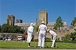 England,Somerset,Wells. With Wells Cathedral in the background a game of summer croquet takes place on the lawns in front of the Bishops Palace