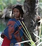 A young Afar girl at Filwoha in the Awash National Park. Filwoha in the Afar language means 'hot water'. The beautiful springs are surrounded by doum palms and rise from deep underground at about 96.8 degrees F.