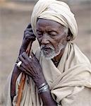 An old Borana man at Chew Bet in southern Ethiopia. His unbleached cotton wrap and turban are typical of the older generation of his tribe.The pastoral Borana live either side of the southern Ethiopian/northern Kenya border and form a large and important group of the Oromo-speaking cluster of tribes.