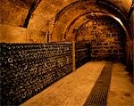 Racks of wine bottles maturing in an underground cellar at Bodega Real Divisa winery in the village of Abalos. This is one of the oldest wineries in Spain dating back to the 14th Century.