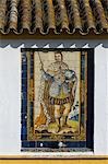 Mural of one of the historic Spanish kings made from painted ceramic tiles,adorns the wall of a house in the Santa Cruz district of Seville,Spain