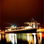 Container Ship;  Ship illuminated at night
