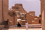 An Omani man insideNakhl Fort which stands in the foothills of the Western Hajar Mountains. The early foundations are thought to pre-date Islam. The mainly 17th century fortress visible today stands over 30 metres high and covers 3,400 square metres.