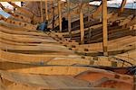 Boat builders constructing a large dhow in the boat yard at Sur