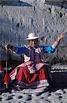 Quechua woman spinning wool.