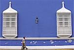 A couple walk the streets of Trujillo in northern Peru,where intricate ironwork and pastel shades are features of the city's colonial mansions on the Plaza de Armas.