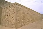 The pyramidal,adobe walls of the Huaca Arco Iris (Rainbow Temple) decorated with elaborate relief carvings. The temple is from the Chimu empire - lasting from about AD 850 to 1470.
