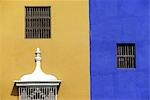 Wrought iron grillwork and pastel shades of the colonial mansions fronting the Plaza de Armas in Trujillo,Peru. The city in Peru's north,is one of the earliest colonial cities and was founded by Francisco Pizarro in 1535.