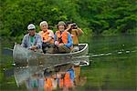 Peru,Amazon,Amazon River. Earthwatch Volunteers and scientist travelling on the Yavari River to the start of a land Transect to observe & record fauna & flora,Lago Preto,Amazon,Peru. .