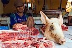 Philippines,Luzon Island,The Cordillera Mountains,Mountain Province. Bontoc food market - pig head on pork stand.