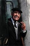 Old lisbon man enjoying a cigarette in his doorway beside the Castelo Sao Jorge,Lisbon,Portugal