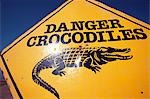 Beware of crocodile sign on St Lucia Beach.