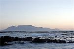 South Africa,Western Cape,Cape Town. Looking across to Melkbosstrand and Table Mountain at sunset.