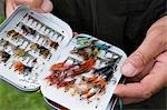 A salmon fisherman chooses his fly on the River Ba on the Benmore Estate Beat.